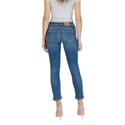 Women’s light blue skinny jeans with a brown leather patch on the back waistband