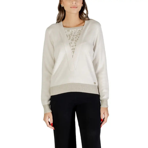 Women’s beige long-sleeved V-neck knit sweater with subtle animal print underlay