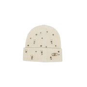 Cream ribbed knit beanie with scattered embellishments and gold-toned logo charm