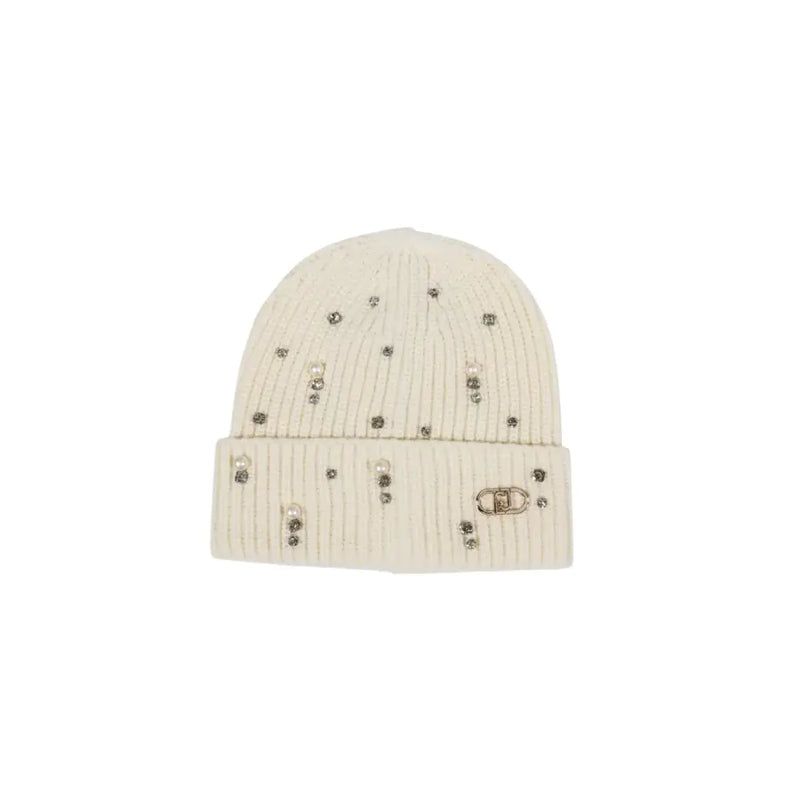 Cream ribbed knit beanie with scattered embellishments and gold-toned logo charm