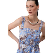 A woman wearing a Liu Jo women blue floral cotton sleeveless dress with thin straps and a matching waist belt