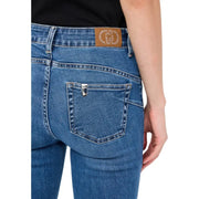 Back side of liu jo women’s blue cotton blend jeans featuring a brown leather patch with rhinestones and silver button