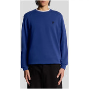 Lyle and Scott men beige cotton round neck sweatshirt with royal blue crewneck and white ribbed trim and black logo