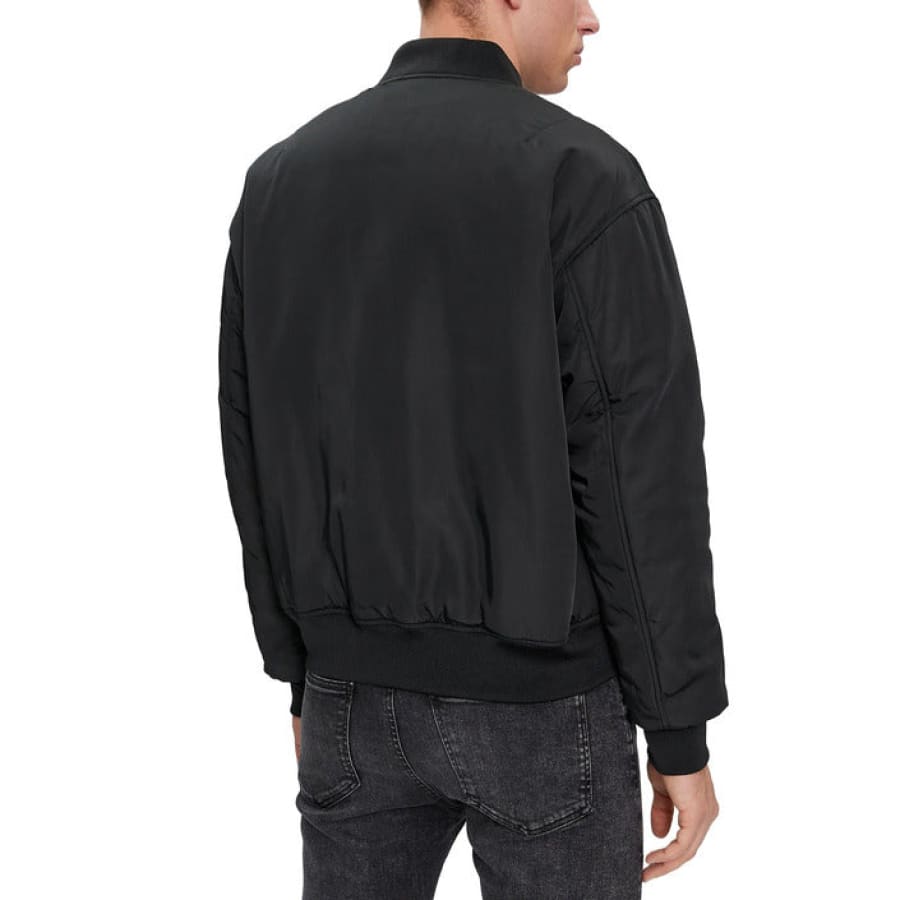 Man wearing Calvin Klein Jeans black bomber jacket