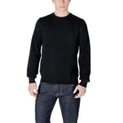 Man in black crewneck sweater and dark wash jeans displayed in product listing