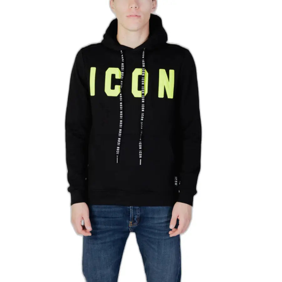 
                      
                        Man in Icon Men Sweatshirt, black with neon green letters, urban city style clothing
                      
                    
