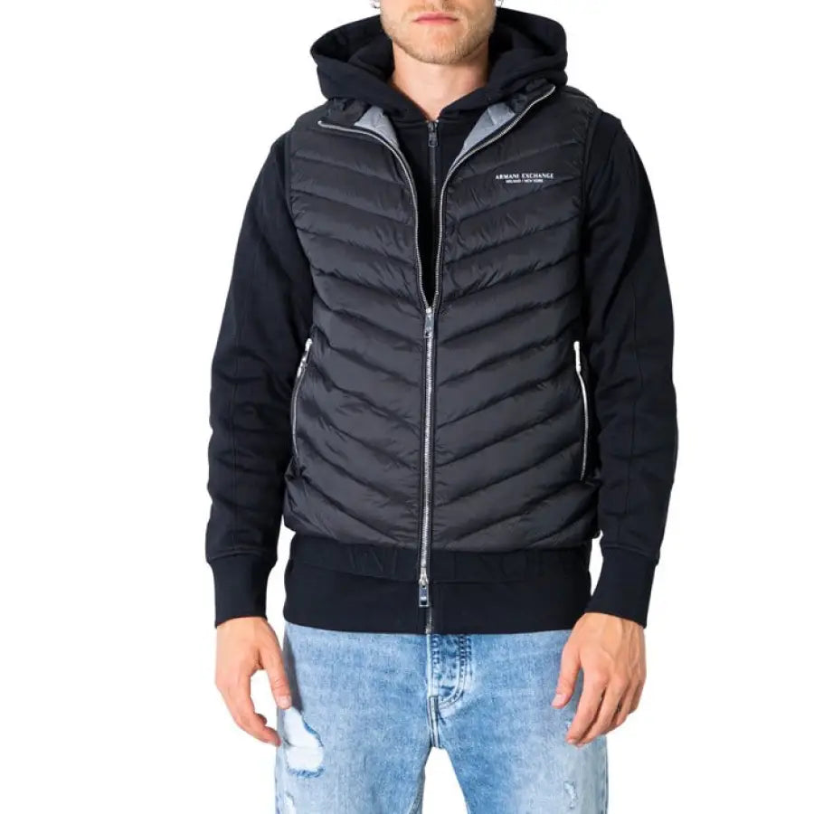 Man in Armani Exchange black jacket and jeans