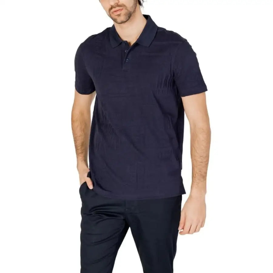 Model wearing Armani Exchange Men Polo in black shirt and pants