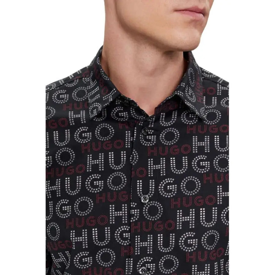 
                      
                        Man in Hugo Hugo Men Shirt, black with white letters.
                      
                    