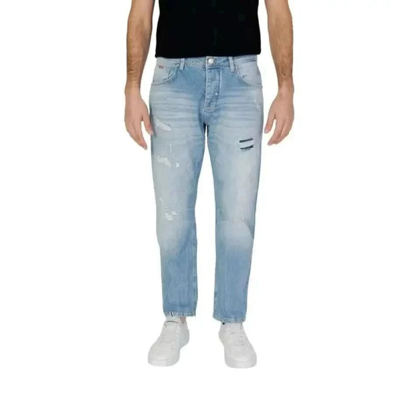 Man modeling Antony Morato jeans in a black T-shirt for Antony Morato Men Jeans product.