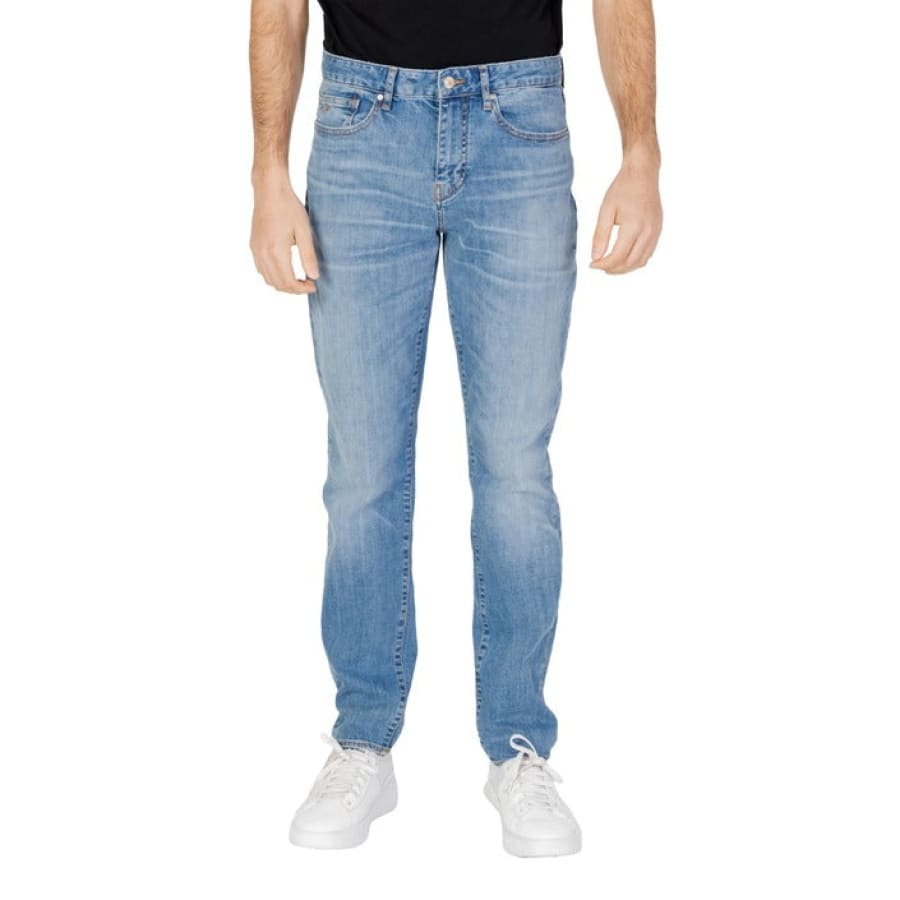 Man wearing Armani Exchange Men Jeans and black t-shirt