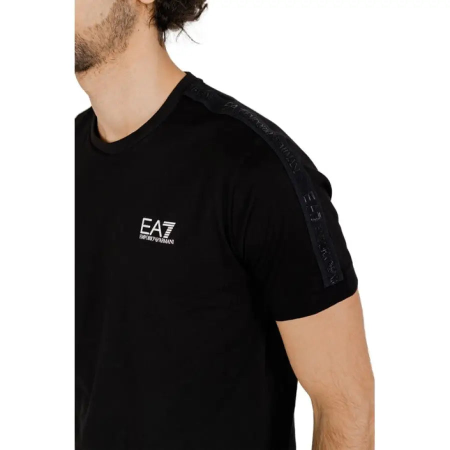 
                      
                        Ea7 men wearing black Ea7 men T-Shirt with white logo on chest
                      
                    