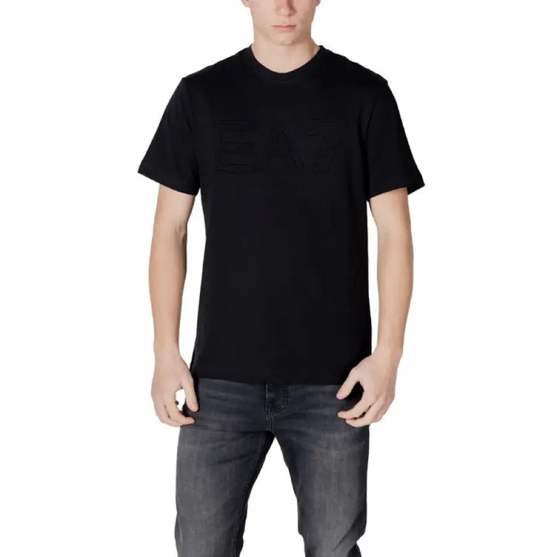 Man wearing Ea7 Men White Cotton T Shirt with black t-shirt and gray jeans