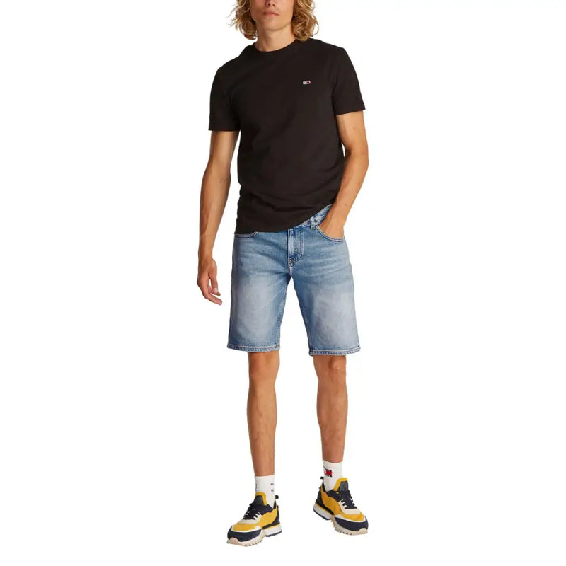 Man wearing black T shirt and denim shorts displaying the Men Black T Shirt and Denim Shorts product