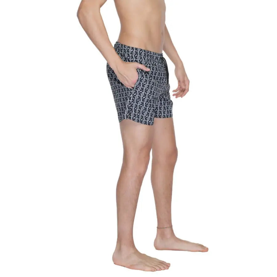 
                      
                        Emporio Armani Underwear model in black and white patterned boxer shorts for men
                      
                    