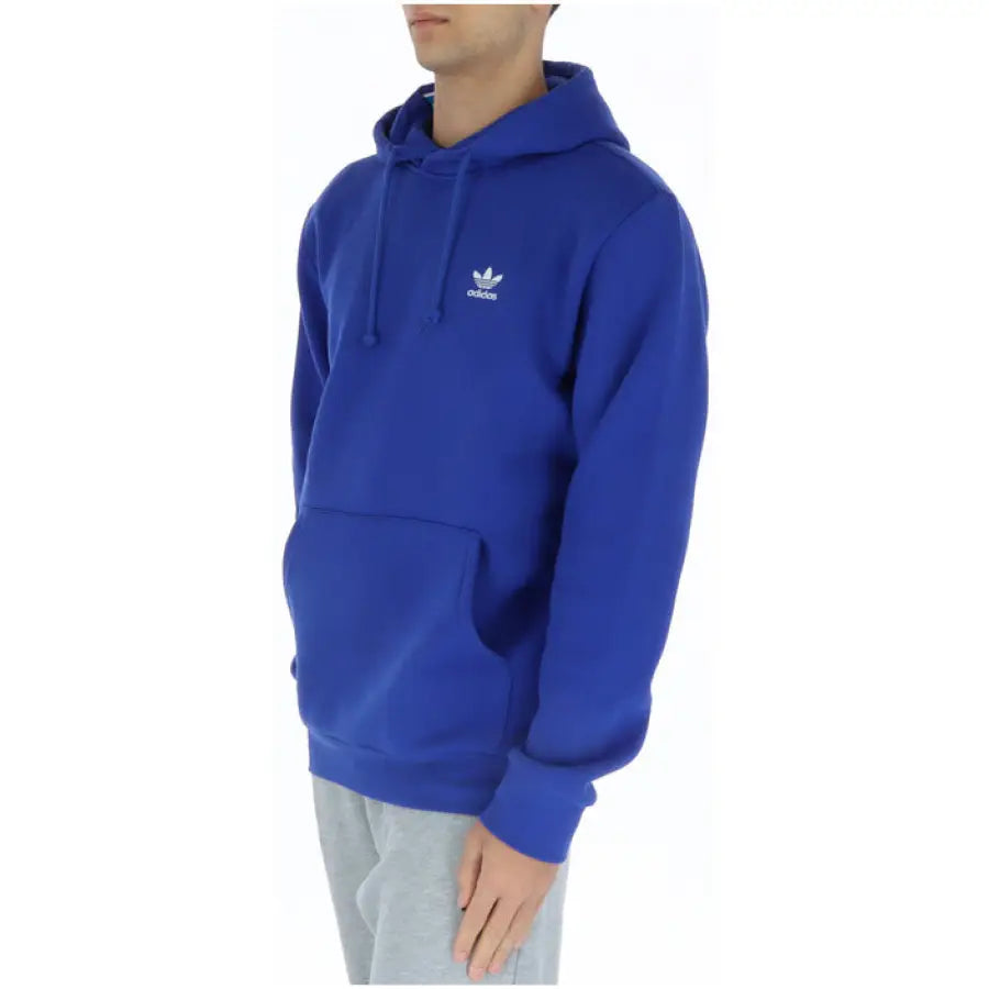 Man in Adidas blue hoodie sporting urban city style fashion