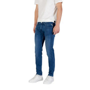Man wearing blue denim jeans and white sneakers in product showcase