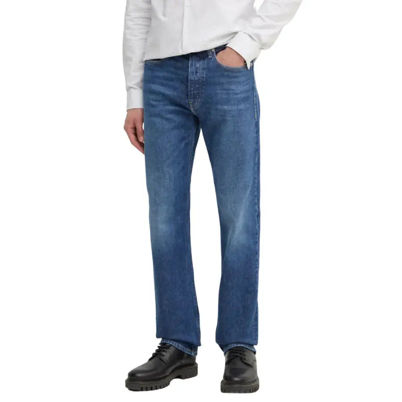 Man wearing blue jeans and black shoes in Men’s Blue Denim Jacket and Jeans product image