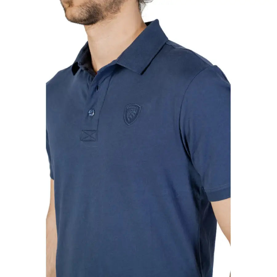 
                      
                        Man in blue polo shirt embodying urban city style for Blauer Men Polo clothing
                      
                    