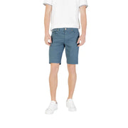 Man wearing blue shorts and white sneakers from Mens Casual Shorts T Shirt And Sneaker Collection