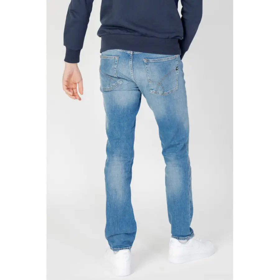 
                      
                        Man modeling Gas Men Jeans and blue sweater for Gas Gas brand.
                      
                    