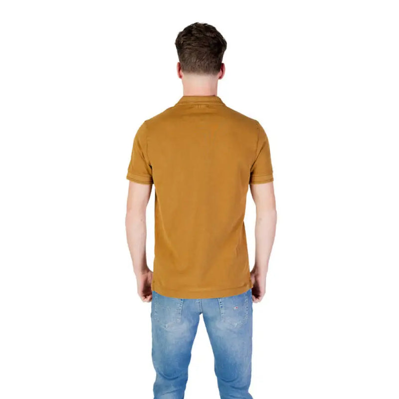 Man modeling a Replay Men’s Yellow Short Sleeve Polo Shirt with blue jeans