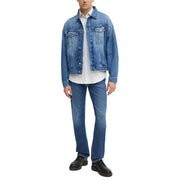 Man wearing a denim jacket and jeans in blue, suitable for Men’s Blue Denim Jacket And Jeans product