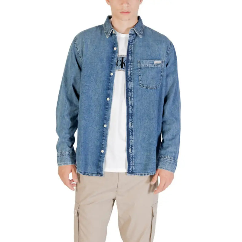 Man wearing a denim shirt and khaki pants displayed in Men Blue Denim Long Sleeved Shirt product image