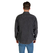 Man wearing a men’s gray denim long sleeve shirt showcasing casual style