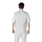 Man in gray workwear showcasing the Light Gray Vest and Shorts Set