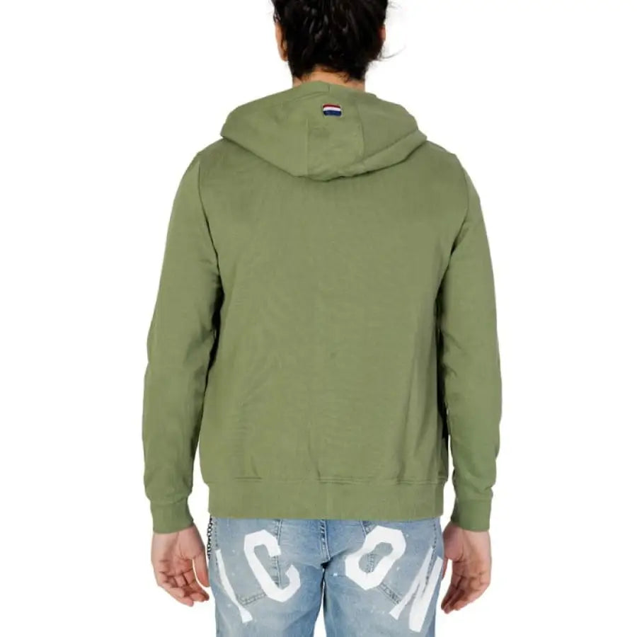 
                      
                        Man in U.S. Polo Assn. green hoodie, men sweatshirts, apparel accessories
                      
                    