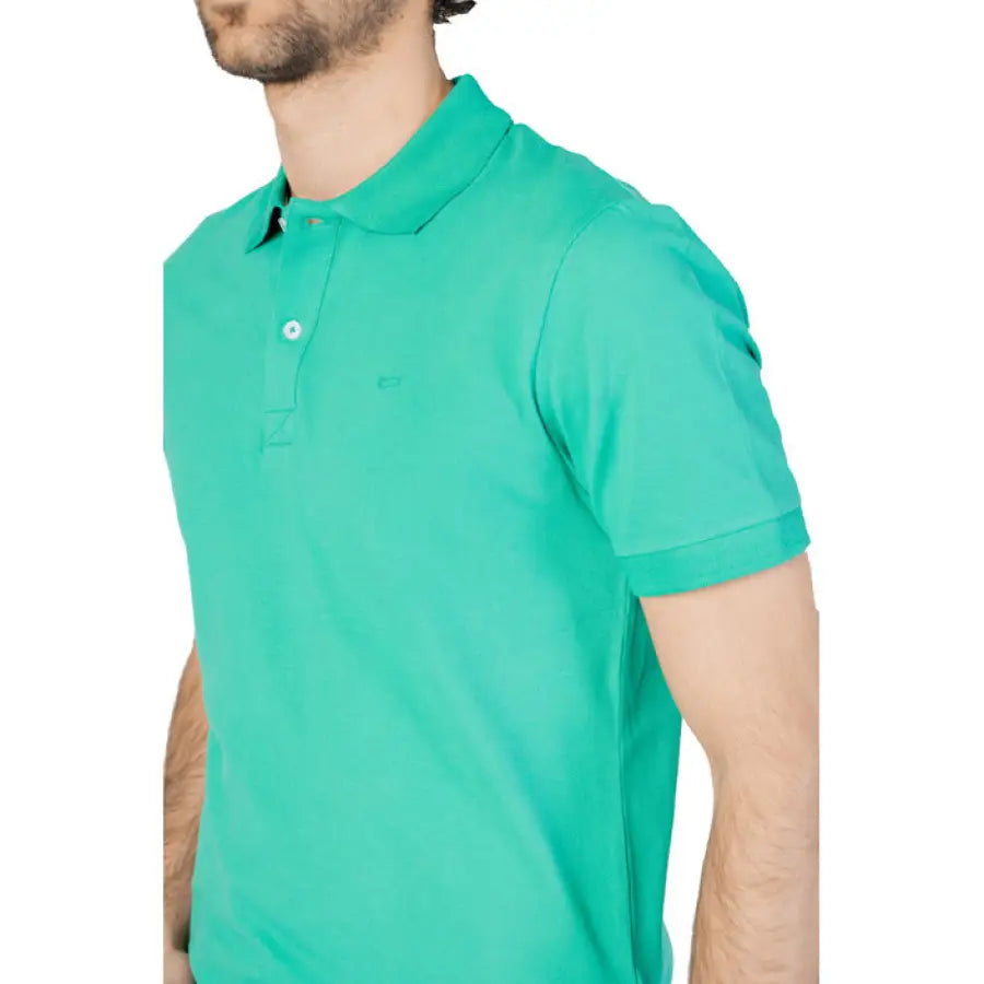 
                      
                        Man in green Gas - Gas Men Polo showcasing urban city style clothing
                      
                    