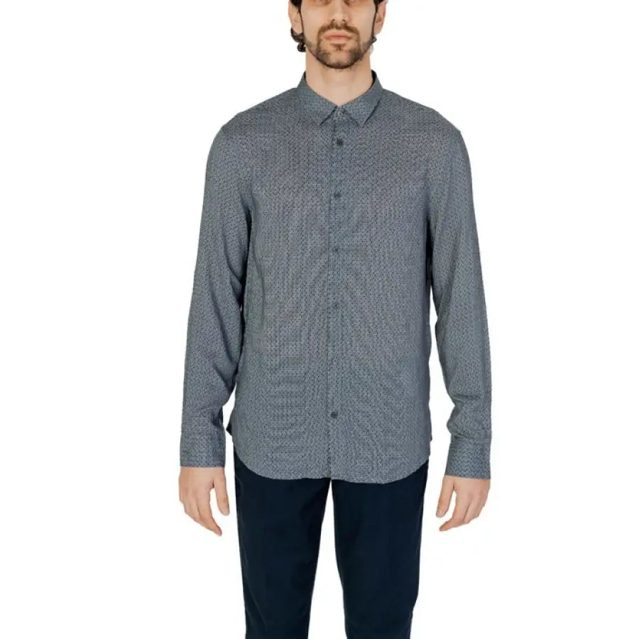 Armani Exchange men’s shirt with model in grey shirt and black pants