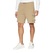 Man wearing khaki cargo shorts and black tank top for men’s casual wear