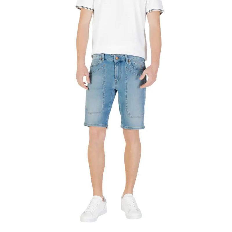 Man wearing light blue denim shorts and white sneakers for Men’s Light Blue Denim Shorts with White Sneakers