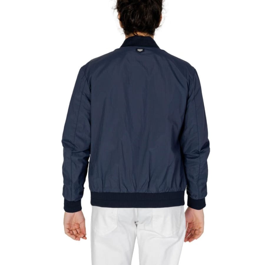 Man in Antony Morato navy bomber jacket posing for Antony Morato Men Jacket product.