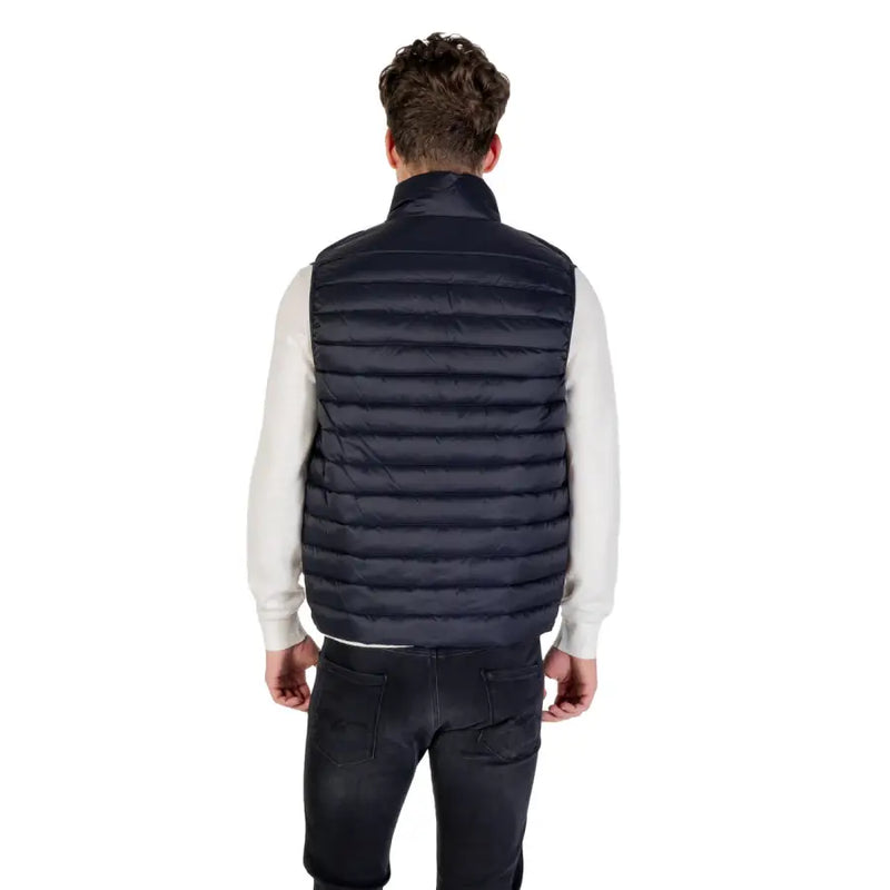 Man wearing a navy blue puffer vest showcasing the Navy Blue Puffer Vest product