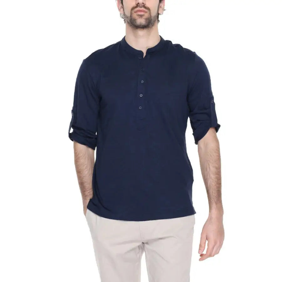 
                      
                        Antony Morato men’s T-shirt modeled by man in navy shirt and beige pants
                      
                    