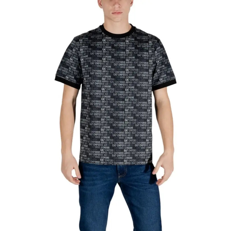 Man in patterned Ea7 Black Print Cotton T-Shirt with jeans showcasing casual style