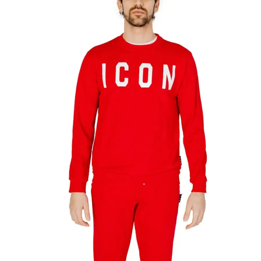
                      
                        Man in Icon urban style clothing, red sweatshirt and pants, showcases urban city fashion
                      
                    