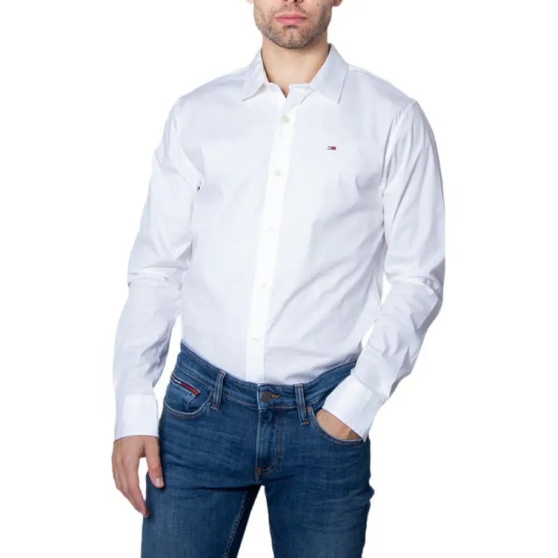 Image of a man wearing a white button-down shirt and blue jeans displayed in the product named Man in Black Button Down Shirt and Blue Jeans