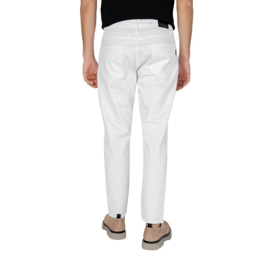 Antony Morato model in stylish Antony Morato Men Jeans, white pants and black shirt.