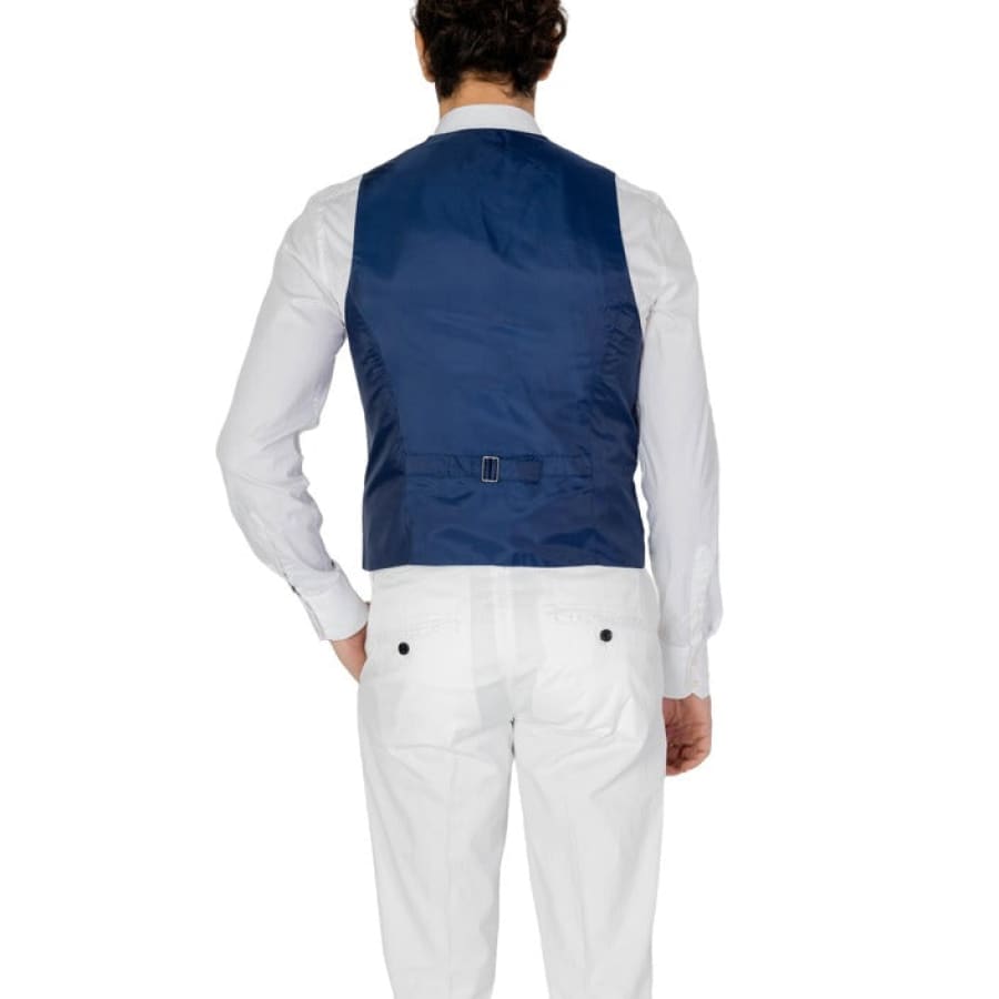 Man in Only & Sons men gilet, white shirt, blue vest.