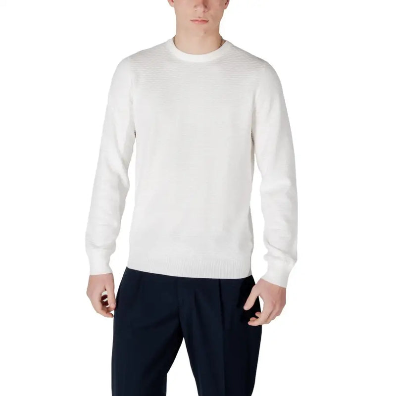Man in white sweater and dark pants, stylish casual male fashion image