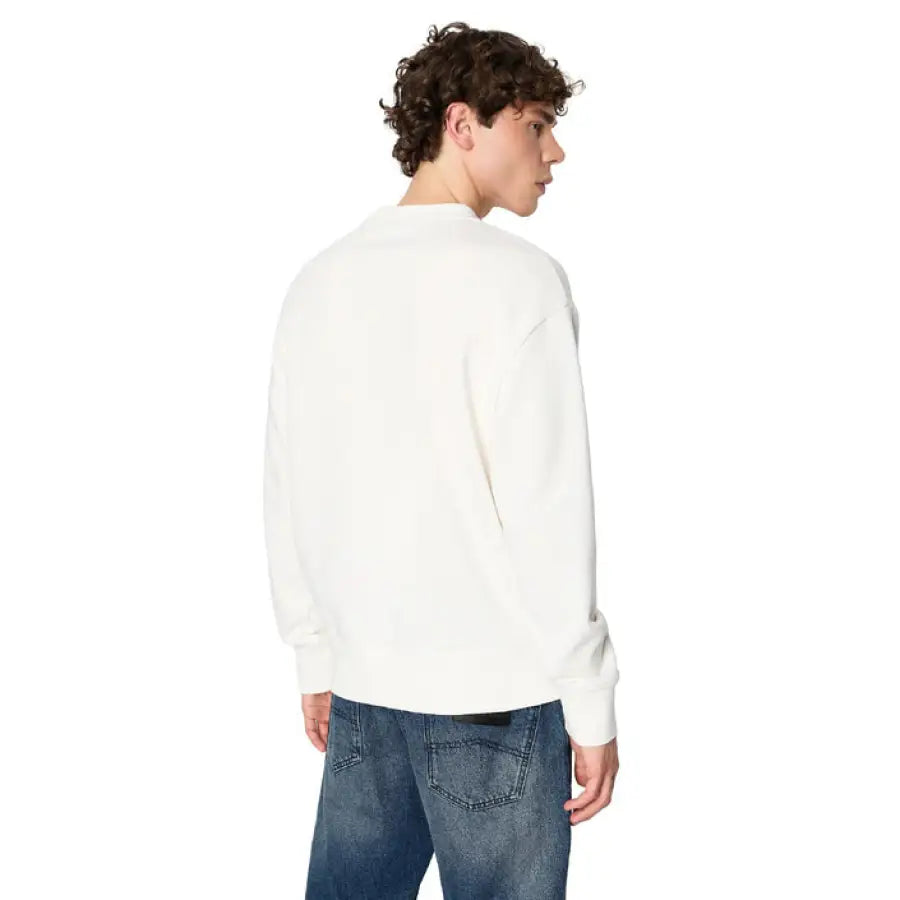 Man in Armani Exchange white sweatshirt representing urban style clothing in the city