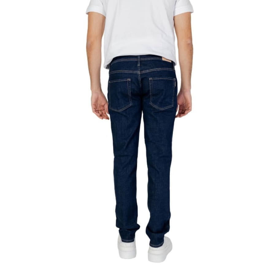 Man wearing Antony Morato jeans and white t-shirt for Antony Morato Men Jeans product.