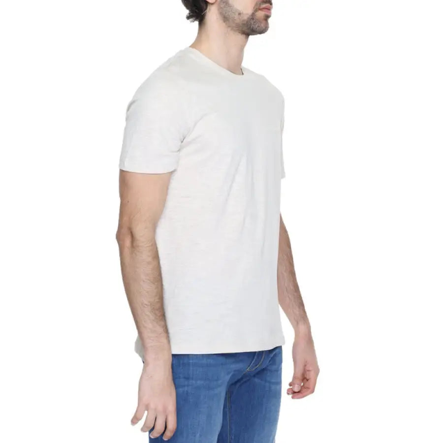 
                      
                        Man wearing Antony Morato T-Shirt, white tee, and jeans
                      
                    