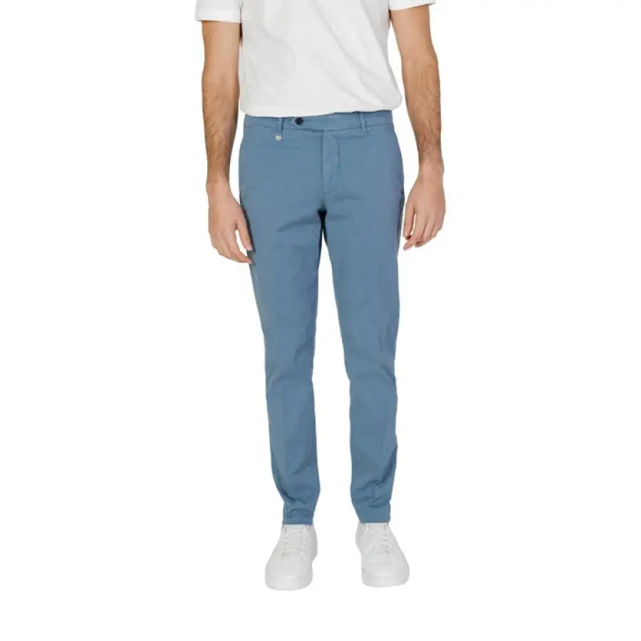 
                      
                        Antony Morato men in spring summer blue trousers and white t-shirt
                      
                    