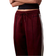 Maroon Calvin Klein Jeans Bordeaux Lace Trousers for Women with white side stripes and drawstring waist