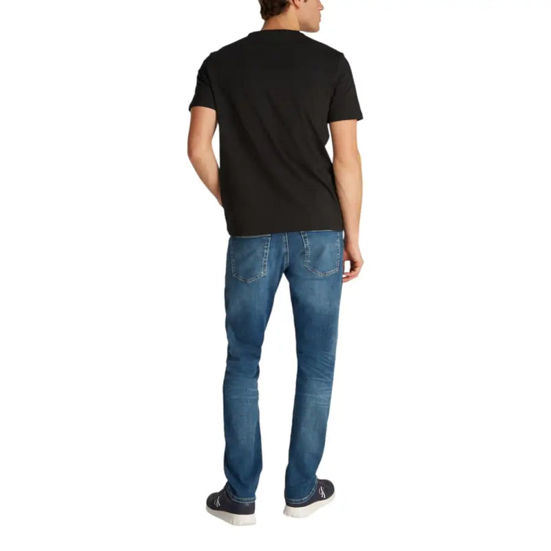 Mens black short sleeve t shirt made of soft cotton with a crew neck worn by a model